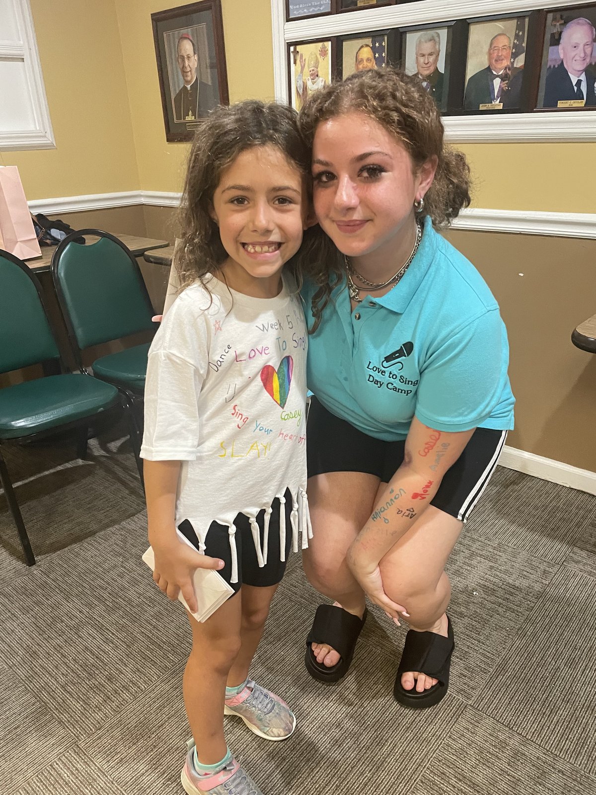 Instructor with camper and signed LTS shirt