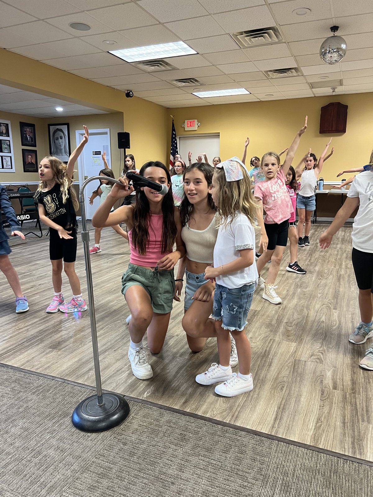 Kids doing face painting and crafts at Love To Sing camp